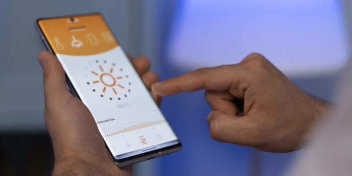 hand-holding-smartphone-home