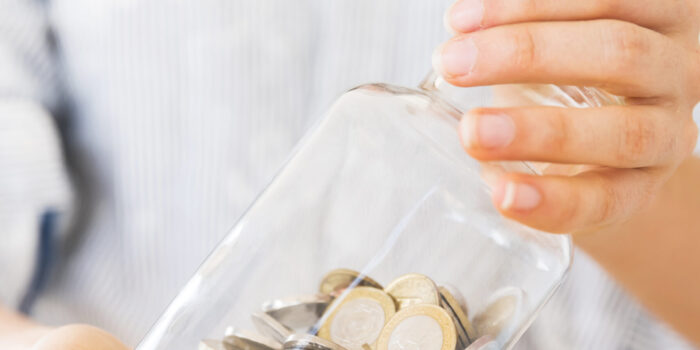 woman-holding-jar-with-money